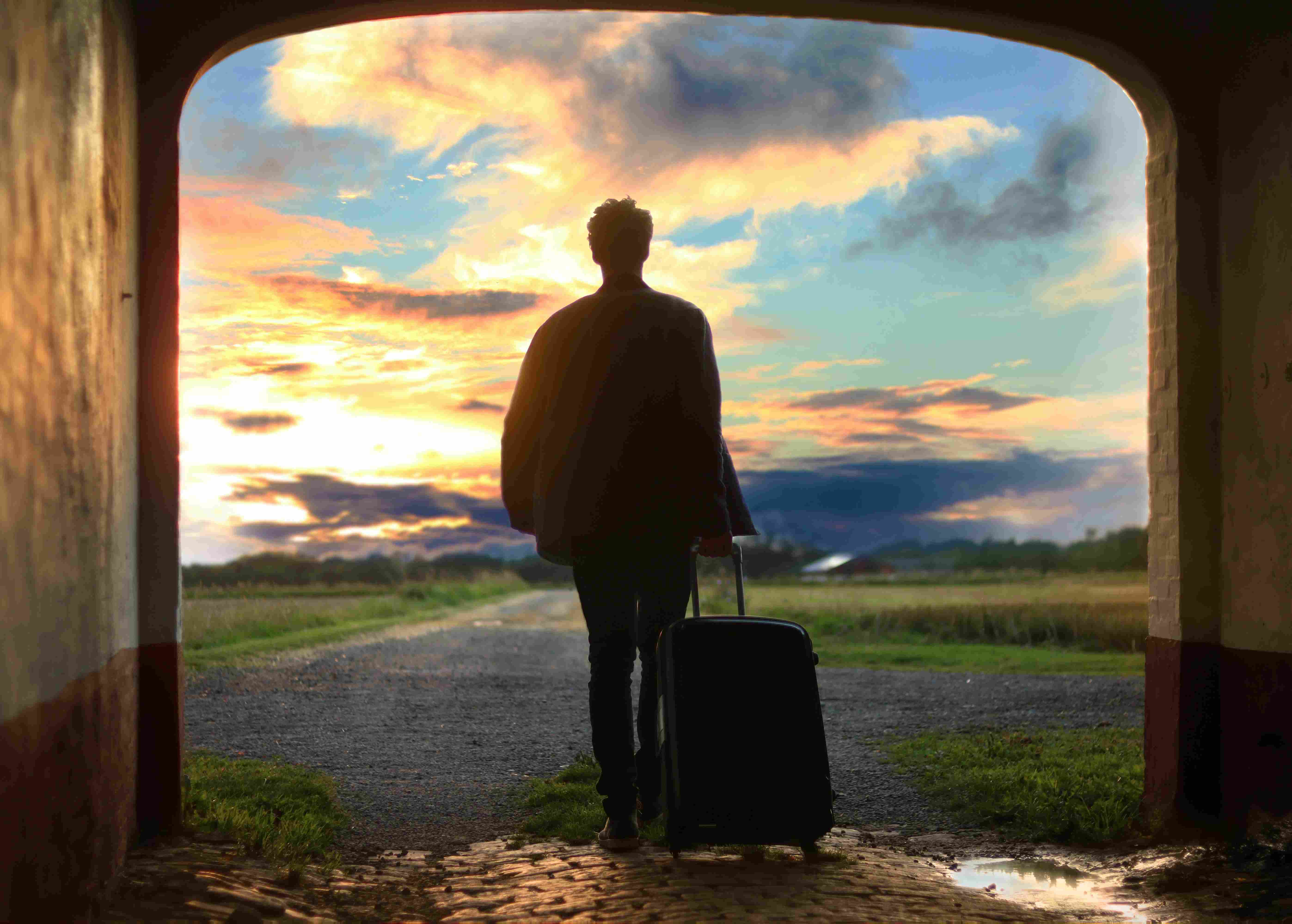 Traveler beginning a journey at sunset